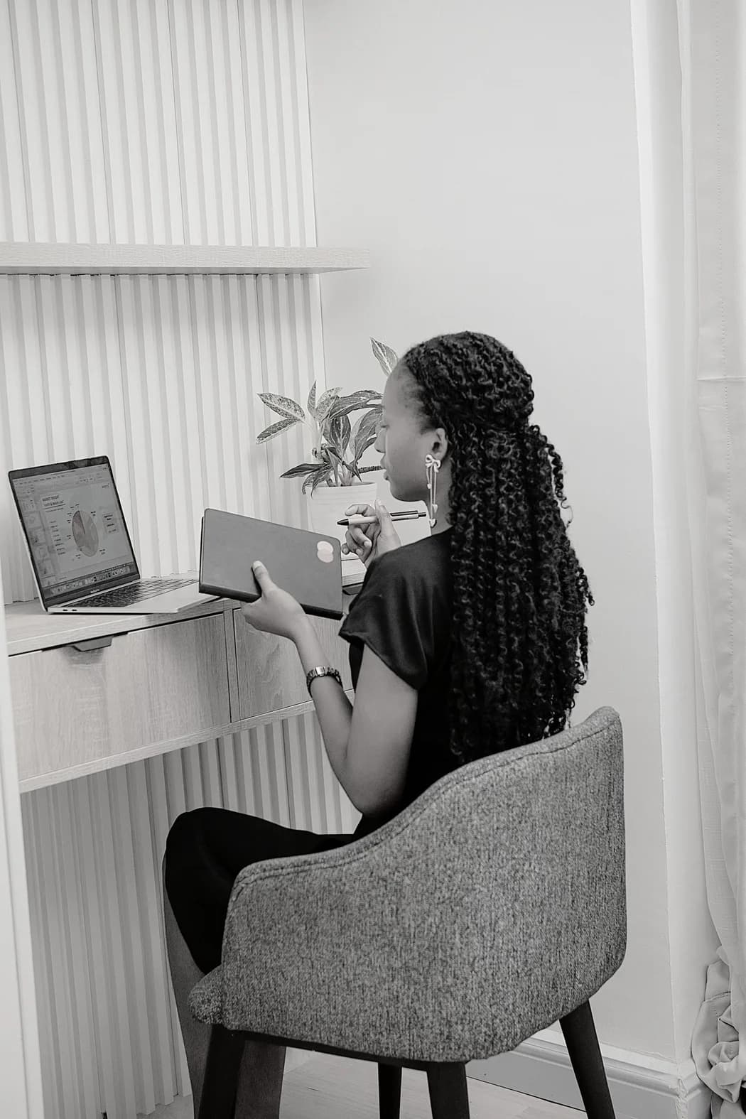 A professional working remotely at a laptop in a calm home setting